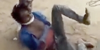 Villagers Torture a Handcuffed Man