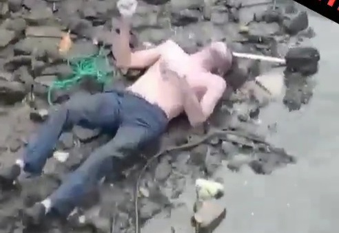 Dead body floating in river showing stabbing wounds 