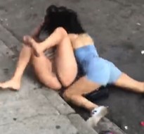 Women fighting over a cock