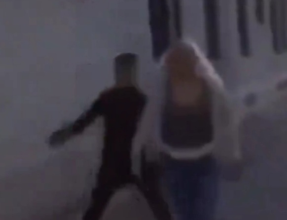 Migrant hits Swedish girl for fun while his friend films and laughs.