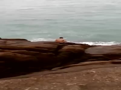 Man Gets Taken Out by Huge Wave