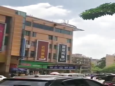 Crowd Watches As Man Falls To His Death From A Tall Building 