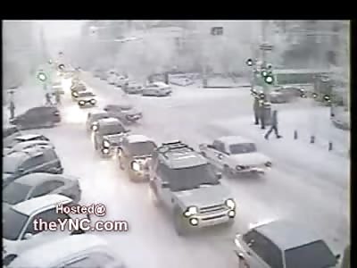 Snowy Road is a Perfect Reason NOT to Cross a Busy Road...IDIOT!!!